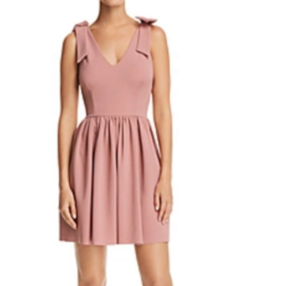 Aqua mini dress with bow shoulder strap.